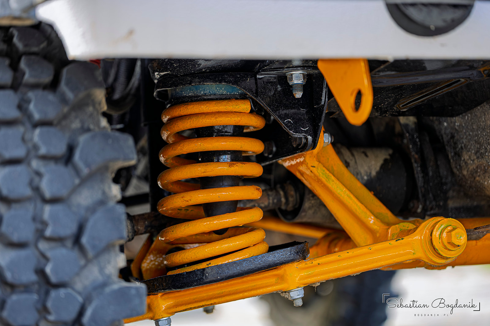 A Lada Niva on lifted suspension with bright yellow springs (2/2)