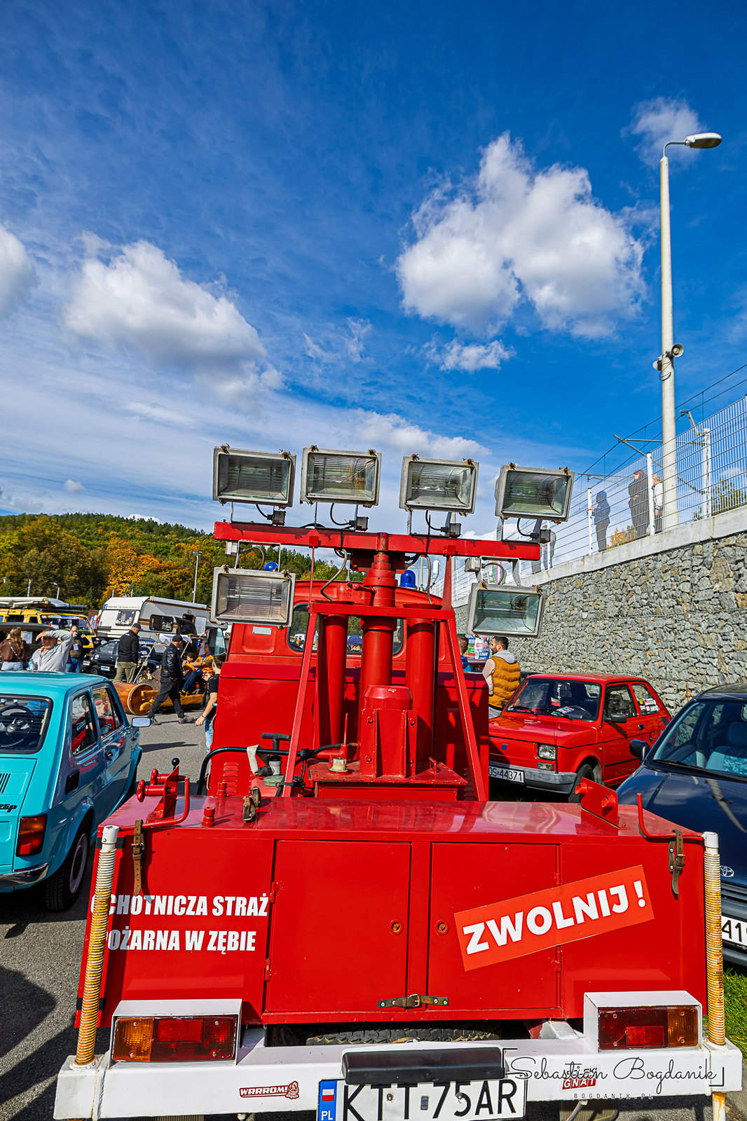 A fire truck politely asking you to “SLOW DOWN,” and the builder’s plate of its generator, made by Karelma in Piechowice (1/2)
