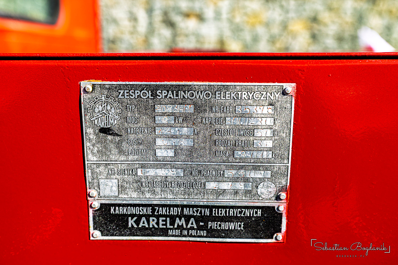 A fire truck politely asking you to “SLOW DOWN,” and the builder’s plate of its generator, made by Karelma in Piechowice (2/2)